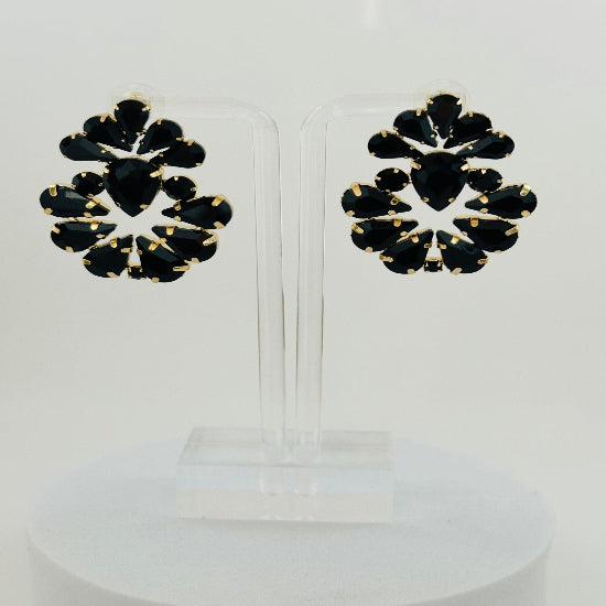 Black stud earrings with a classic, polished finish, offering a sleek and versatile accessory for any occasion.