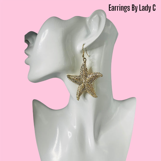 Starry Kiss gold star earrings with a delicate, celestial sparkle