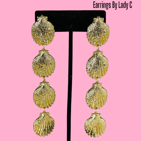 Ocean Life gold shell earrings inspired by the sea, with a polished coastal design