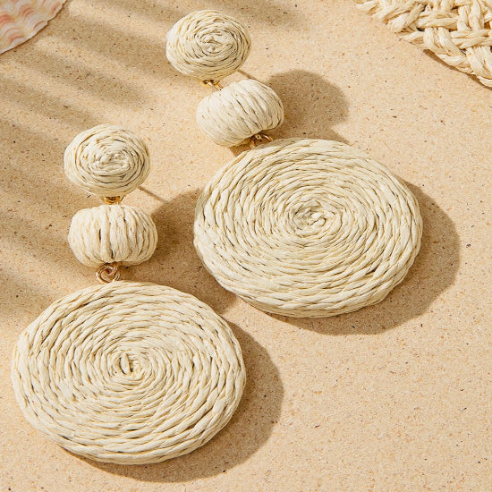 Close-up image of braid earrings with intricately woven textures, designed for a chic and contemporary look.