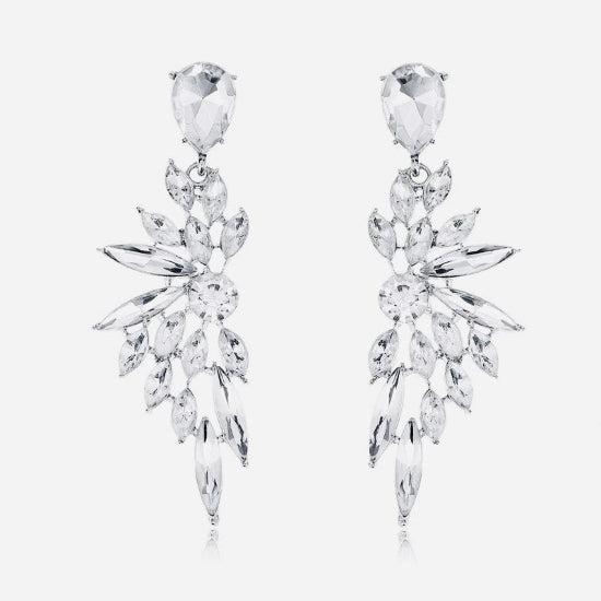 Pair of silver earrings with clear gemstones on a white background