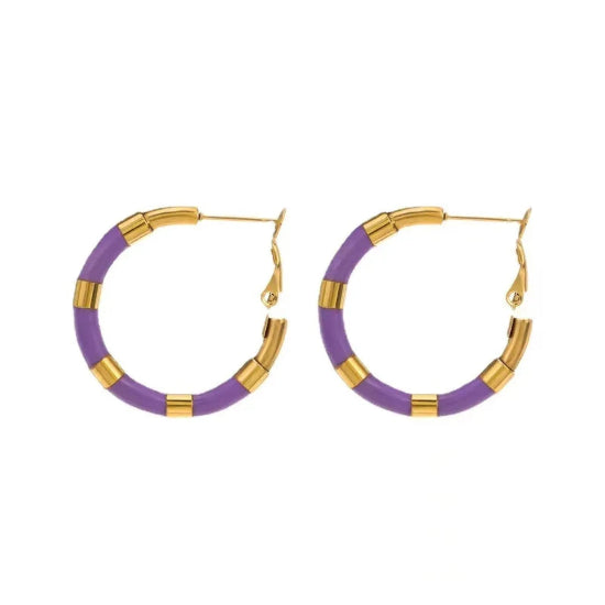 Close-up of shimmering purple rhinestone hoop earrings, featuring a vibrant and chic design for any outfit or event.