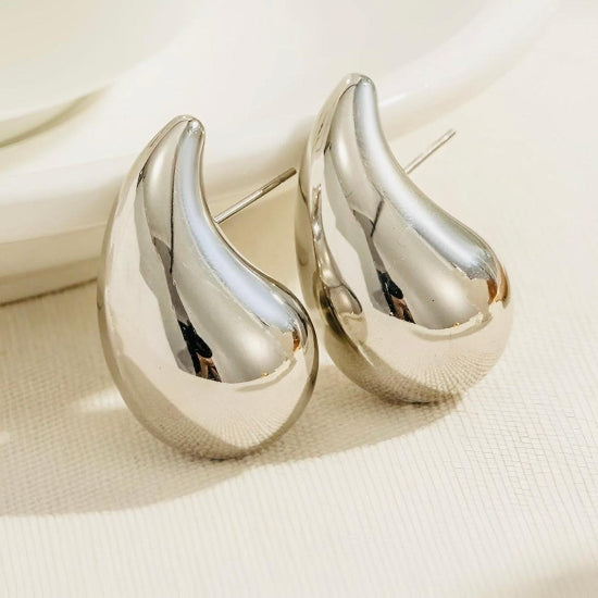 Elegant silver Bottega drop earrings featuring a sleek, contemporary design with a luxurious polished finish.