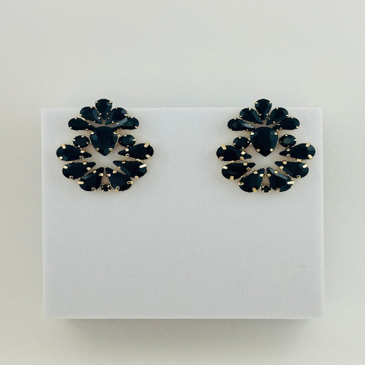 Black stud earrings with a classic, polished finish, offering a sleek and versatile accessory for any occasion. 