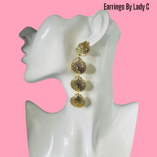 Ocean Life gold shell earrings inspired by the sea, with a polished coastal design