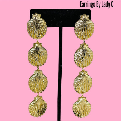 Ocean Life gold shell earrings inspired by the sea, with a polished coastal design