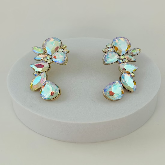 Pair of earrings with iridescent gemstones on a white stand