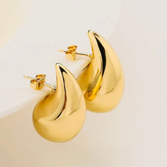 Elegant gold Bottega drop earrings featuring a sleek, contemporary design with a luxurious polished finish.