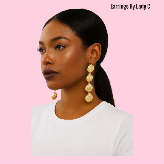 Ocean Life gold shell earrings inspired by the sea, with a polished coastal design